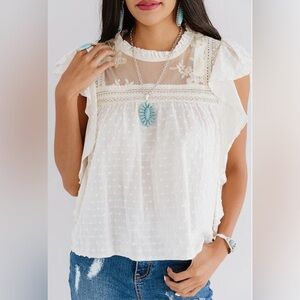 Olivaceous White Flutter Swiss Dot top with gorgeous embroidered detail.